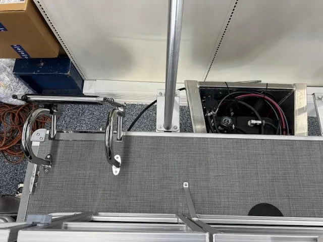 Slide: The Image of 2024 Starcraft EX 20 C boat interior showing deck and railing components. - 17