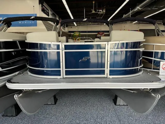 Slide: The Image of 2024 Starcraft EX 20 C pontoon boat in showroom. - 3