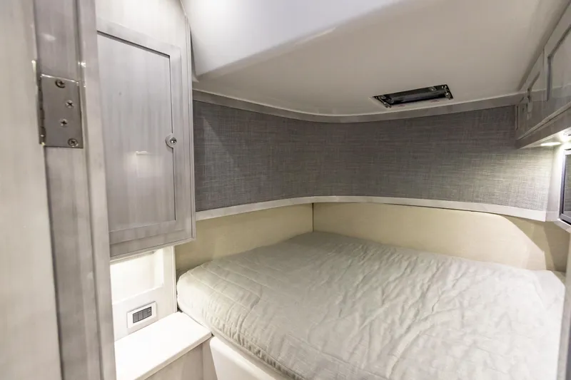 Slide: The Image of Interior cabin of 2022 HCB 65 Estrella with bed and storage cabinet. - 10