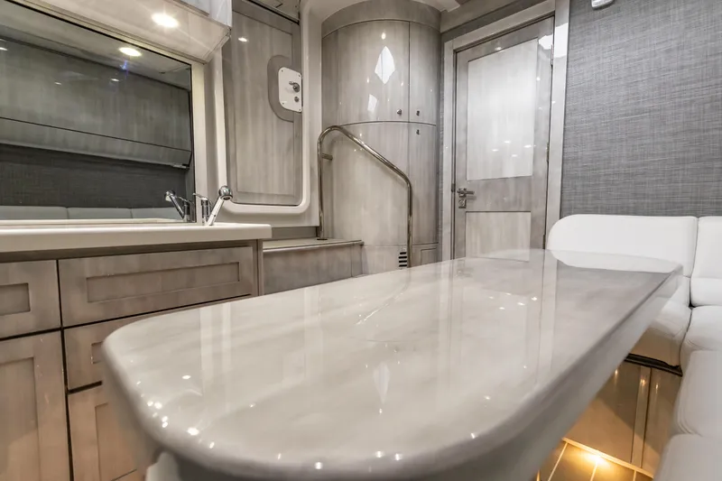 Slide: The Image of Interior of 2022 HCB 65 Estrella yacht with modern kitchen and seating area. - 12
