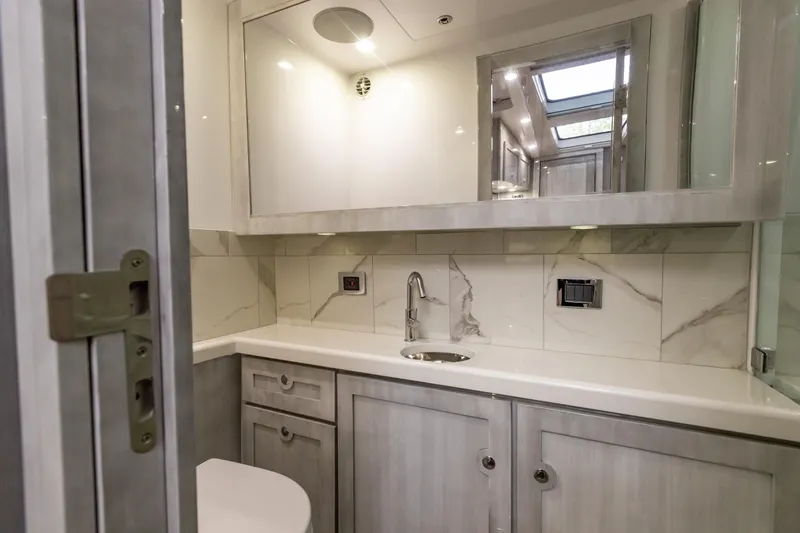 Slide: The Image of Modern bathroom in 2022 HCB 65 Estrella yacht with marble tiles and sleek fixtures. - 14