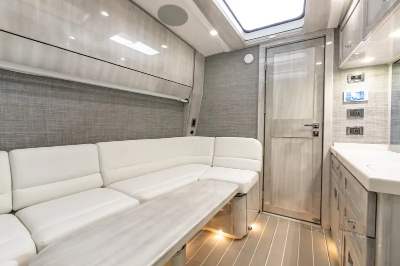 Slide: The Image of Luxurious interior of 2022 HCB 65 Estrella yacht with white leather seating and modern design. - 25