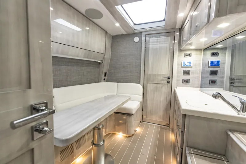 Slide: The Image of Interior of 2022 HCB 65 Estrella yacht with modern kitchen and seating area. - 3