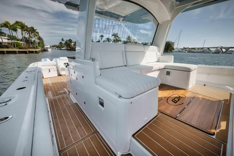 Slide: The Image of Luxury interior of 2022 HCB 65 Estrella yacht with white seating and wooden deck. - 32