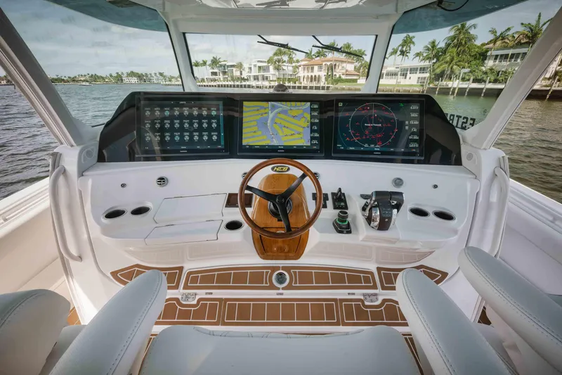 Slide: The Image of 2022 HCB 65 Estrella boat helm with advanced navigation screens and luxurious interior. - 39