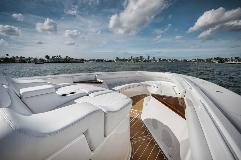 Slide: The Image of Luxury seating on the 2022 HCB 65 Estrella yacht with ocean and city skyline views. - 42