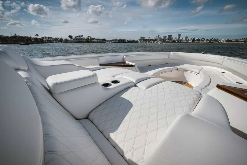 Slide: The Image of Luxurious seating on the 2022 HCB 65 Estrella yacht with ocean and city skyline views. - 43