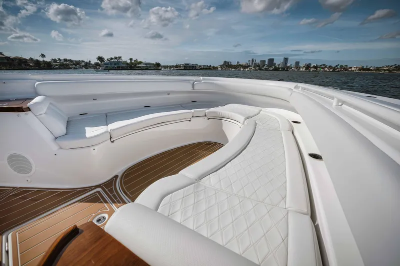 Slide: The Image of Luxurious seating area on the 2022 HCB 65 Estrella yacht with waterfront city view. - 44