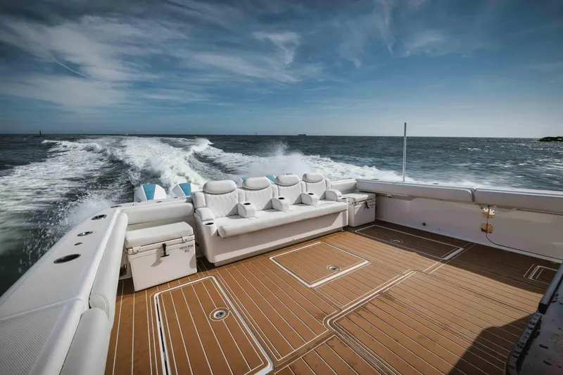 Slide: The Image of 2022 HCB 65 Estrella luxury boat cruising on open water. - 5