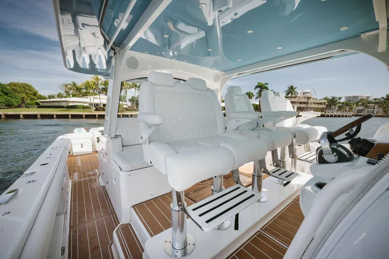 Slide: The Image of Luxury interior of 2022 HCB 65 Estrella yacht with white seating and wooden flooring. - 6