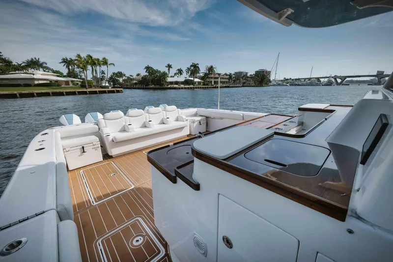 Slide: The Image of 2022 HCB 65 Estrella luxury yacht with spacious deck and waterfront view. - 8