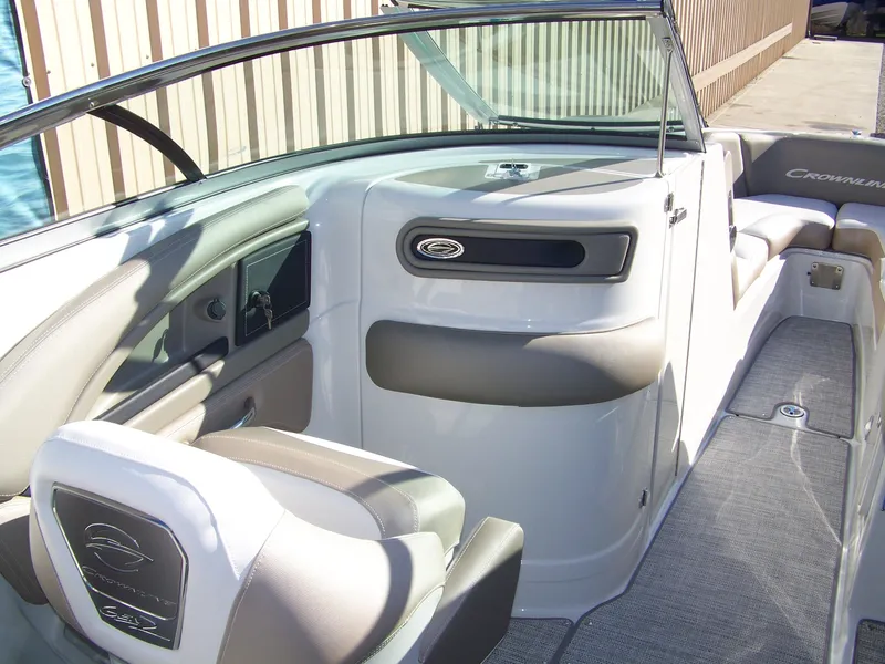 Slide: The Image of 2024 Crownline 280 boat interior with seating and dashboard. - 10