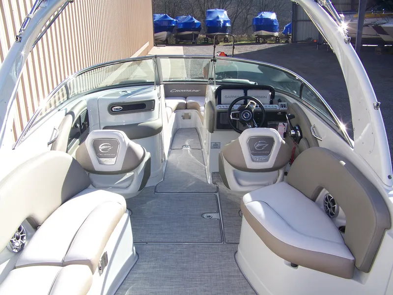 Slide: The Image of 2024 Crownline 280 boat interior with beige and white seating. - 4