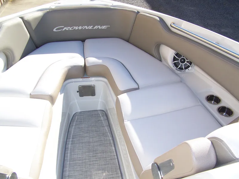 Slide: The Image of 2024 Crownline 280 boat interior with white and beige seating. - 6