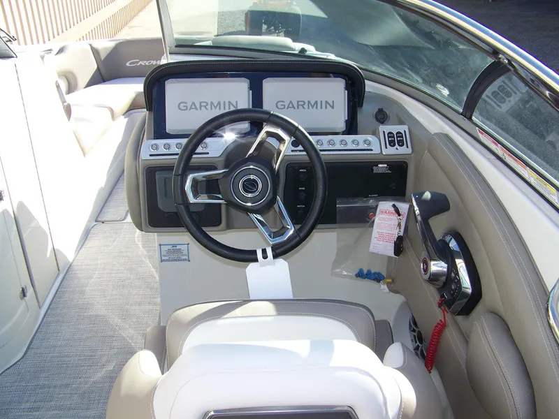 Slide: The Image of 2024 Crownline 280 boat cockpit with Garmin navigation system. - 9