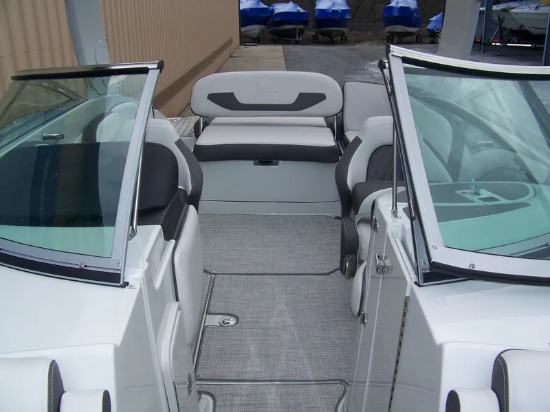 Slide: The Image of 2024 Crownline 260 boat interior with seating and open windshield. - 11