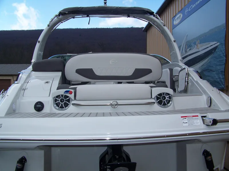 Slide: The Image of 2024 Crownline 260 boat rear view with seating and speakers. - 12