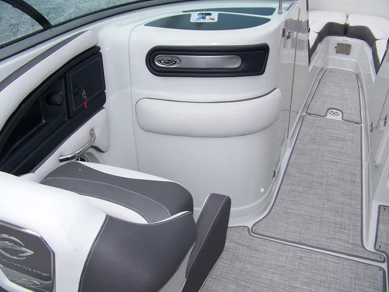 Slide: The Image of 2024 Crownline 260 boat interior with modern seating and sleek design. - 8