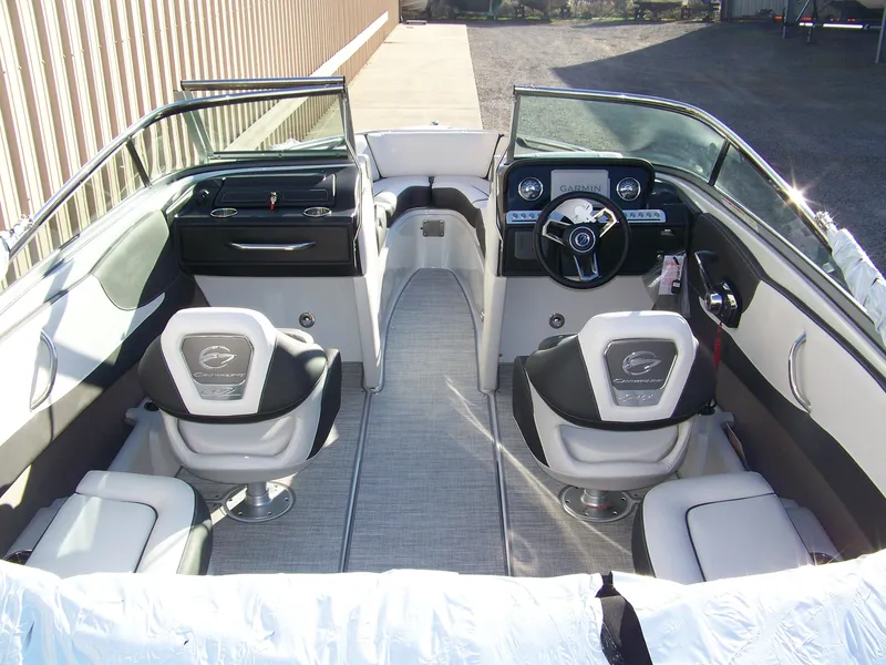 Slide: The Image of 2024 Crownline 240 boat interior with modern dashboard and seating. - 5