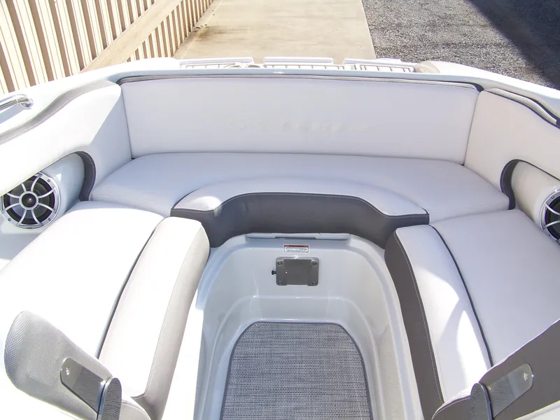 Slide: The Image of 2024 Crownline E235 boat interior with white and gray seating. - 6