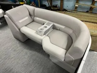 Slide: The Image of 2023 Sweetwater 2286SBX boat seating with cup holders and gray upholstery. - 14