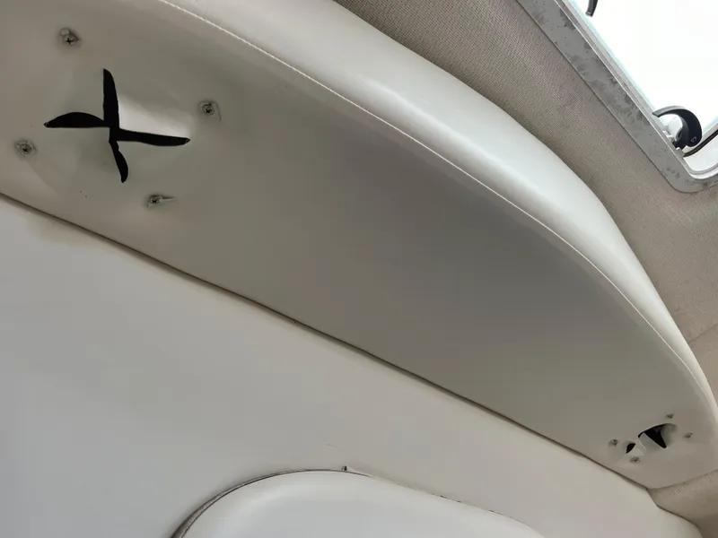 Slide: The Image of Interior view of a 1999 Bayliner 3055 Ciera boat ceiling with visible screws. - 9