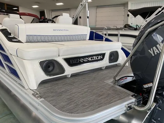 Slide: The Image of 2024 Bennington 23 RSB pontoon boat with Yamaha outboard motor in showroom. - 10
