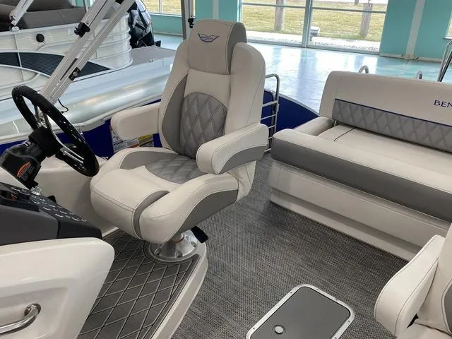 Slide: The Image of 2024 Bennington 23 RSB boat interior with captain's chair and passenger seating. - 14