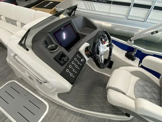 Slide: The Image of 2024 Bennington 23 RSB boat dashboard with steering wheel and control panel. - 15