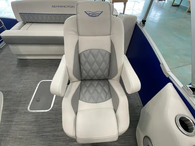 Slide: The Image of 2024 Bennington 23 RSB boat interior with luxury seating and diamond-stitched upholstery. - 17