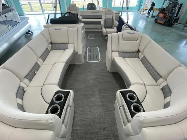 Slide: The Image of 2024 Bennington 23 RSB boat interior with luxurious seating and cup holders. - 19