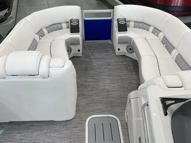 Slide: The Image of 2024 Bennington 23 RSB boat interior with luxurious white seating and modern design. - 20