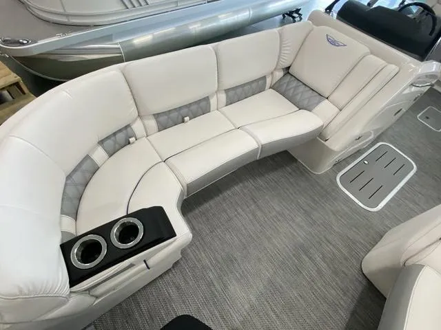 Slide: The Image of 2024 Bennington 23 RSB boat interior with plush seating and cup holders. - 21