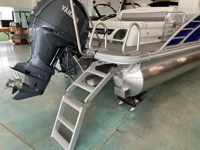 Slide: The Image of 2024 Bennington 23 RSB pontoon boat with Yamaha outboard motor and boarding ladder. - 22