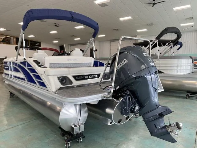 Slide: The Image of 2024 Bennington 23 RSB pontoon boat with Yamaha outboard motor in showroom. - 8