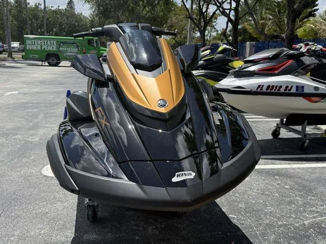 Slide: The Image of 2024 Yamaha WaveRunner FX Limited SVHO with audio system, sleek black and gold design. - 5