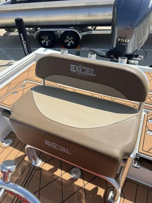 Slide: The Image of 2023 Excel Boats 220 Bay Pro with Yamaha 150 engine and tan seating. - 13