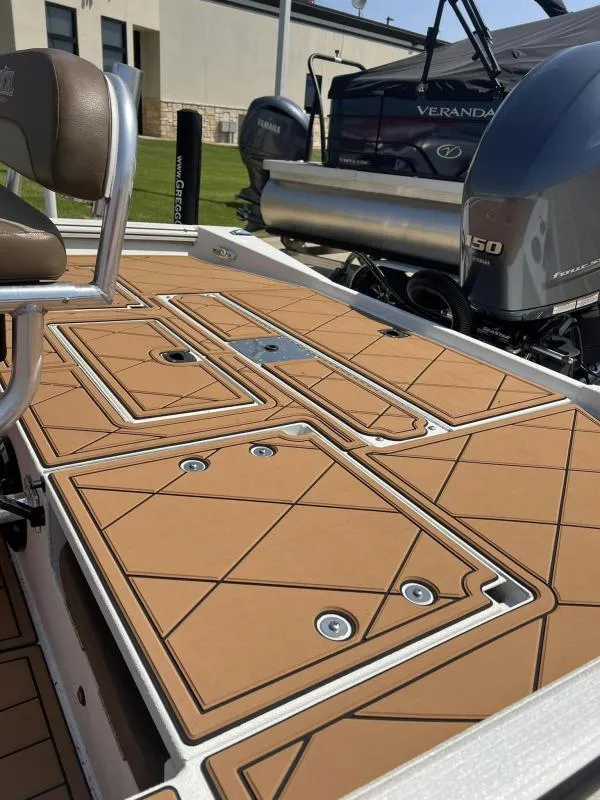 Slide: The Image of 2023 Excel Boats 220 Bay Pro deck with seating and storage compartments. - 16