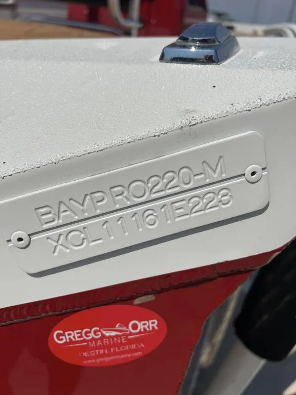 Slide: The Image of 2023 Excel Boats 220 Bay Pro identification plate, Gregg Orr Marine sticker visible. - 18