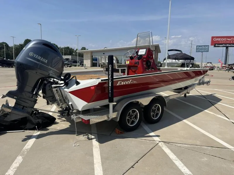 Slide: The Image of 2023 Excel Boats 220 Bay Pro with Yamaha engine in parking lot. - 3