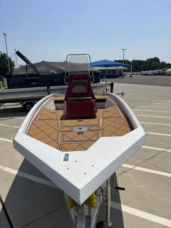 Slide: The Image of 2023 Excel Boats 220 Bay Pro in parking lot, front view. - 6
