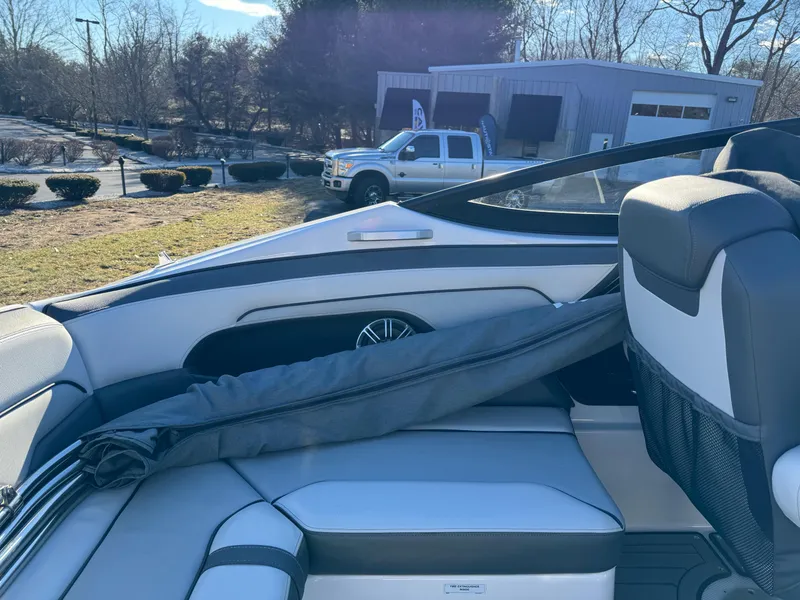 Slide: The Image of Interior of a 2017 Yamaha Boats 212 Limited, showcasing seating and storage. - 12