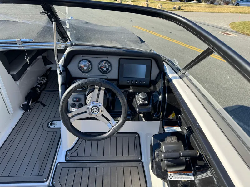 Slide: The Image of 2017 Yamaha Boats 212 Limited dashboard and steering wheel. - 15