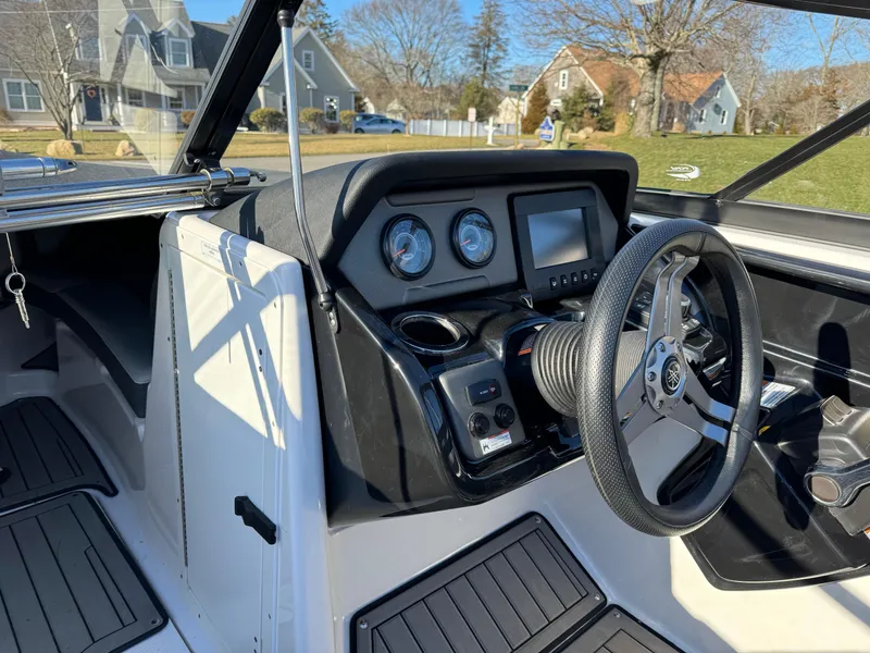 Slide: The Image of 2017 Yamaha Boats 212 Limited dashboard and steering wheel. - 18