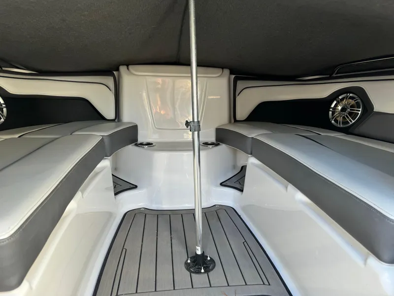 Slide: The Image of Interior of a 2017 Yamaha Boats 212 Limited, featuring cushioned seating and modern design. - 19