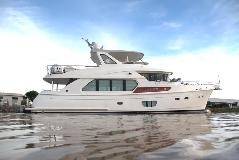 Slide: The Image of 2026 Selene 60 Ocean Explorer yacht on calm water under blue sky. - 0