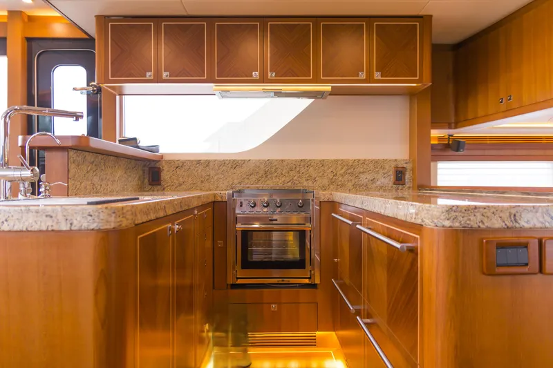 Slide: The Image of Luxurious kitchen interior of 2026 Selene 60 Ocean Explorer yacht with wood cabinetry and granite countertops. - 10
