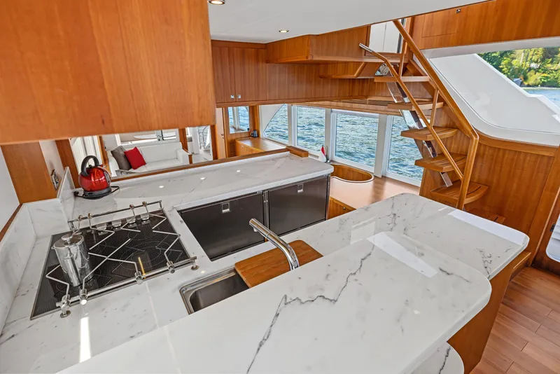 Slide: The Image of Luxurious kitchen interior of 2026 Selene 60 Ocean Explorer yacht with marble countertops and wooden accents. - 12