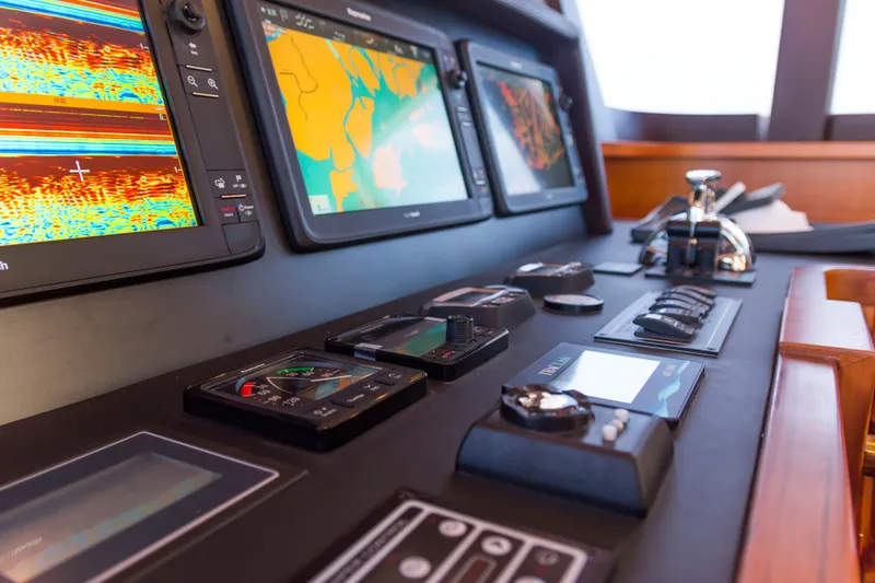 Slide: The Image of Control panel of 2026 Selene 60 Ocean Explorer yacht with navigation screens and instruments. - 14