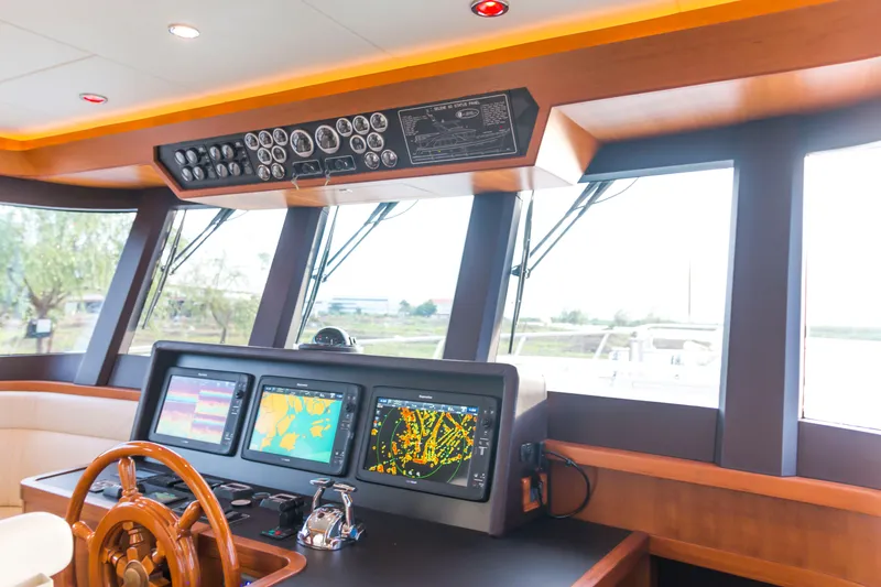 Slide: The Image of Bridge of 2026 Selene 60 Ocean Explorer with advanced navigation systems and wooden steering wheel. - 15